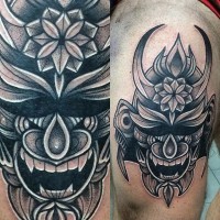 Ornamental style black ink awesome samurai mask tattoo on thigh
