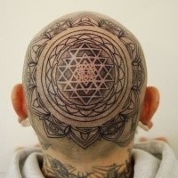 Ornamental style black ink head tattoo of awesome ornament