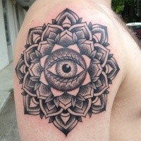 Ornamental style black ink shoulder tattoo of mystical flower with eye