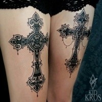 Ornamental style black ink thigh tattoo of large beautiful cross