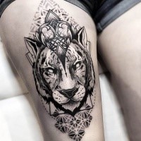 Ornamental style black ink thigh tattoo of lion head with ornaments