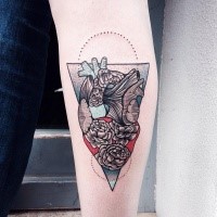 Ornamental style colored arm tattoo of human heart with flowers