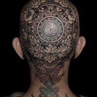 Ornamental style colored head tattoo of beautiful ornaments