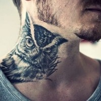 Owl bird tattoo on the neck