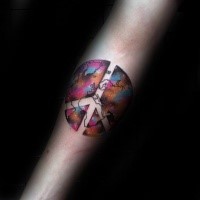 Pacific symbol shaped colored forearm tattoo stylized with world map and space