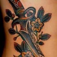 Patchwork dagger with flowers tattoo