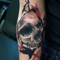 Photoshop style colored forearm tattoo of human skull with black crow