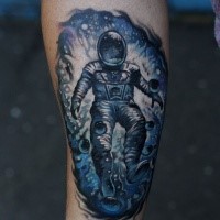 Photoshop style colored forearm tattoo of spaceman