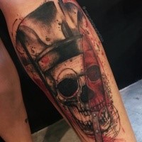 Photoshop style colored leg tattoo of old skull with big knife