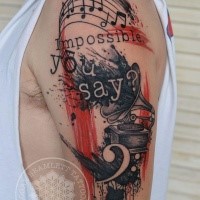 Photoshop style colored shoulder tattoo of old gramophone with lettering