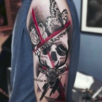 Photoshop style colored shoulder tattoo of human skull with various ornaments and lettering