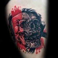 Photoshop style colored thigh tattoo of human skull with red and black lines