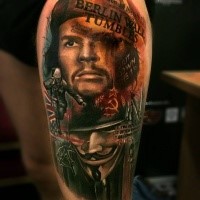 Photoshop style colored thigh tattoo of Che Guevara with lettering and Anonymous