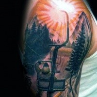 Picture style colored shoulder tattoo of man with sun and mountain