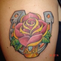 Pink rose and horseshoe tattoo