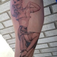 Pinup girl tattoo on forearm by Don Frey