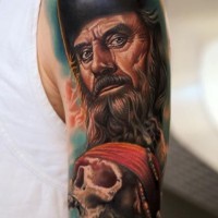 Realistic pirate with a skull in hand of nikko hurtado