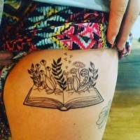 Plants growing from the book original idea thigh tattoo