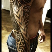 Polynesian style black and white detailed ornaments tattoo on sleeve