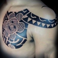 Polynesian style black ink chest tattoo