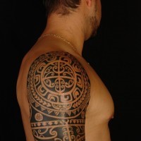 Polynesian style massive black ink ornaments tattoo on shoulder