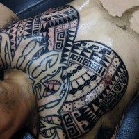 Polynesian style ornaments tattoo on chest