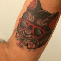 Portrait of a cat wearing glasses with a red rimmed tattoo