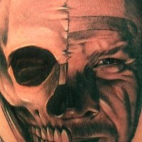 Portrait of half skull half man tattoo