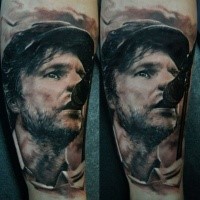 Portrait style colored arm tattoo