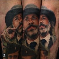 Portrait style colored arm tattoo of vintage man with mustache