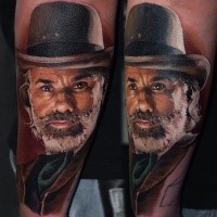 Portrait style colored arm tattoo of vintage man face with beard