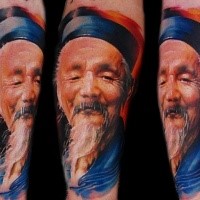 Portrait style colored arm tattoo of Asian old man
