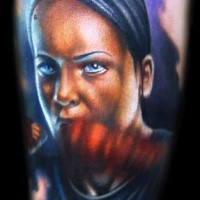 Portrait style colored arm tattoo of boxer woman face