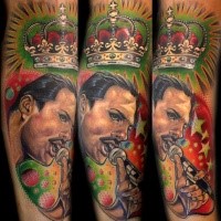 Portrait style colored arm tattoo of Queen with crown
