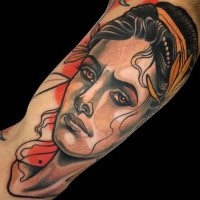 Portrait style colored arm tattoo of sad woman face