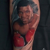Portrait style colored arm tattoo of young Mike Tyson