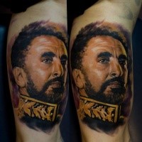 Portrait style colored biceps tattoo of soldier face