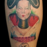Portrait style colored leg tattoo of interesting looking geisha