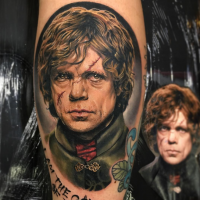 Portrait style colored leg tattoo of Game of Thrones hero face