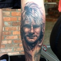 Portrait style colored leg tattoo of Man portrait