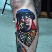 Portrait style colored leg tattoo of man face with stars and money