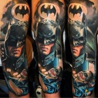 Portrait style colored shoulder tattoo of Batman with Joker