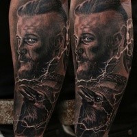 Portrait style colored shoulder tattoo of Viking with crow
