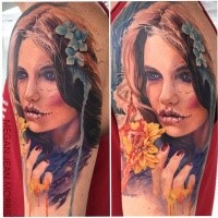 Portrait style colored shoulder tattoo of mystical woman with flowers