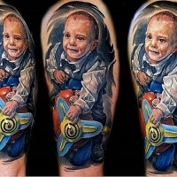 Portrait style colored shoulder tattoo of funny boy with toy plane