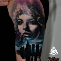 Portrait style colored shoulder tattoo of woman face with night city
