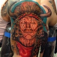 Portrait style colored shoulder tattoo of gorgeous Indian face with helmet