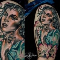 Portrait style colored shoulder tattoo of beautiful woman with flowers