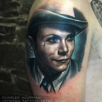 Portrait style colored shoulder tattoo of vintage man face