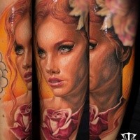 Portrait style colored tattoo of very beautiful woman with flowers